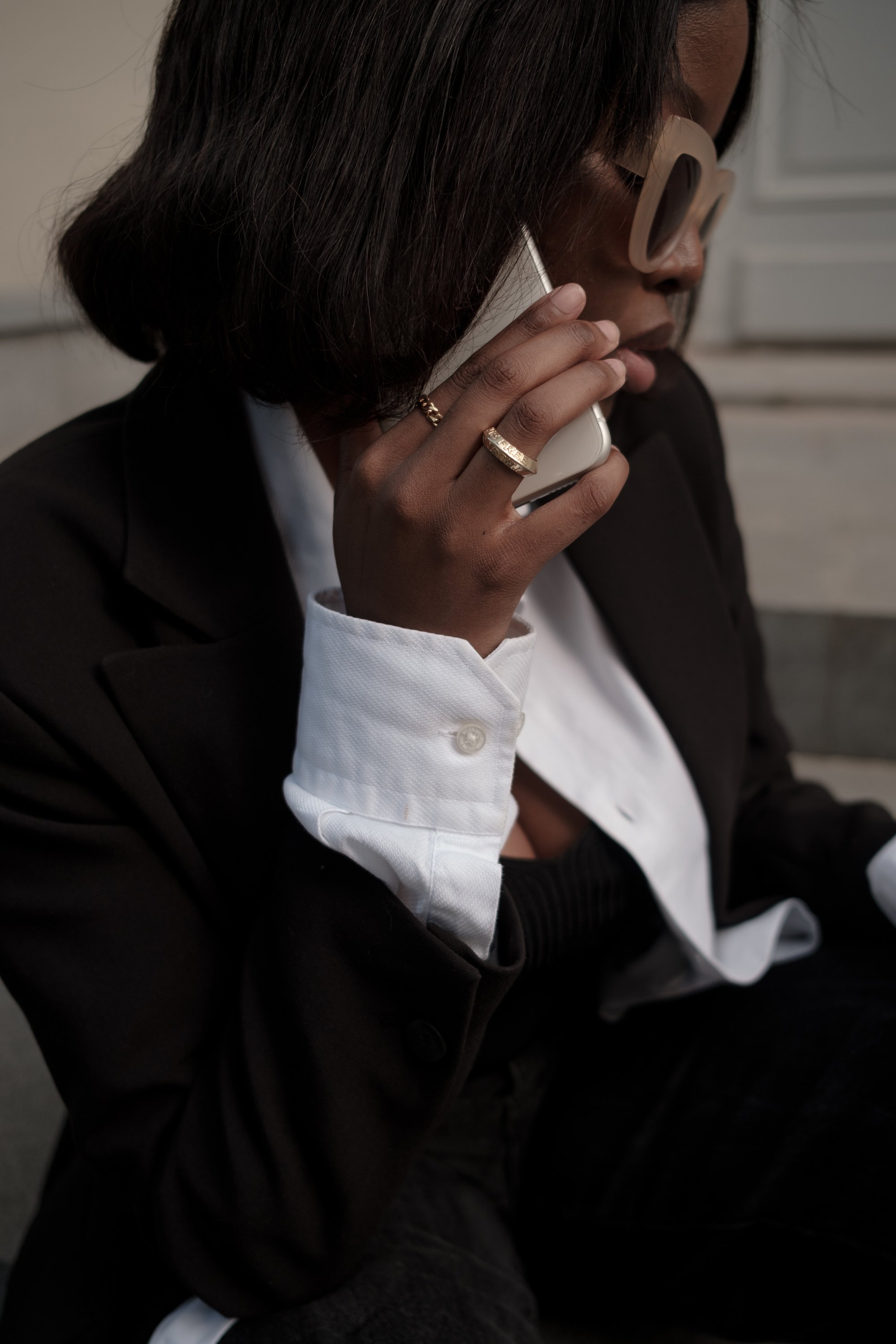 Woman in Business Outfit Talking on the Phone